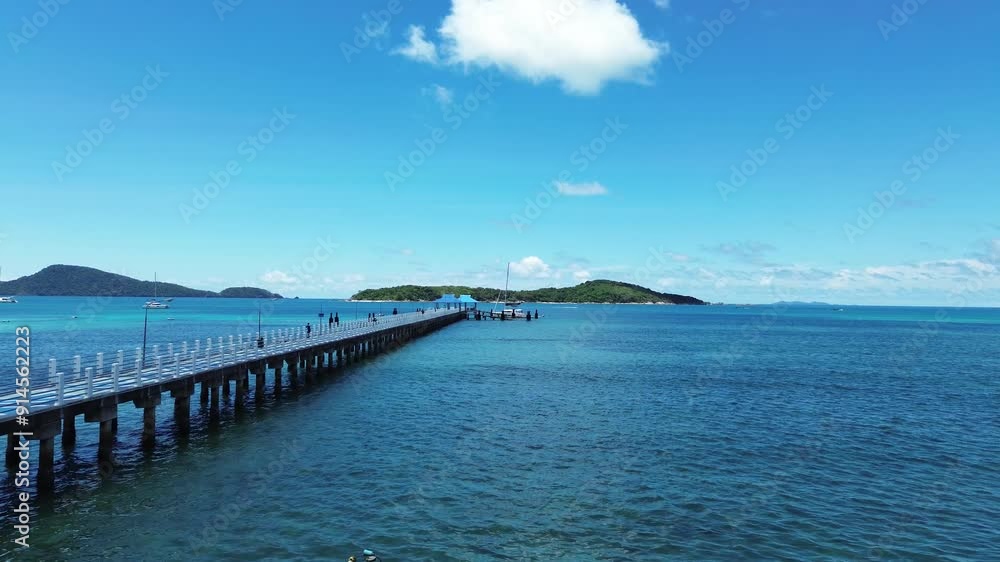 Long landing pier in shallow water, southern part of Phuket island, viewed from a drone Long landing pier in shallow water, southern part of Phuket island, viewed from a drone