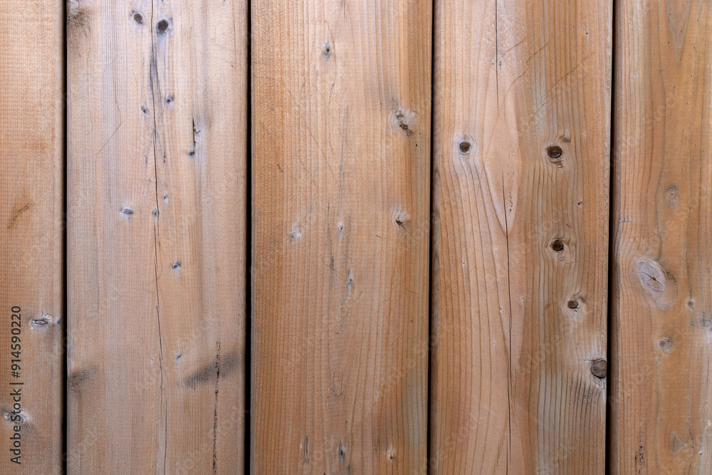 Fototapeta premium Wooden textured fence close up background.