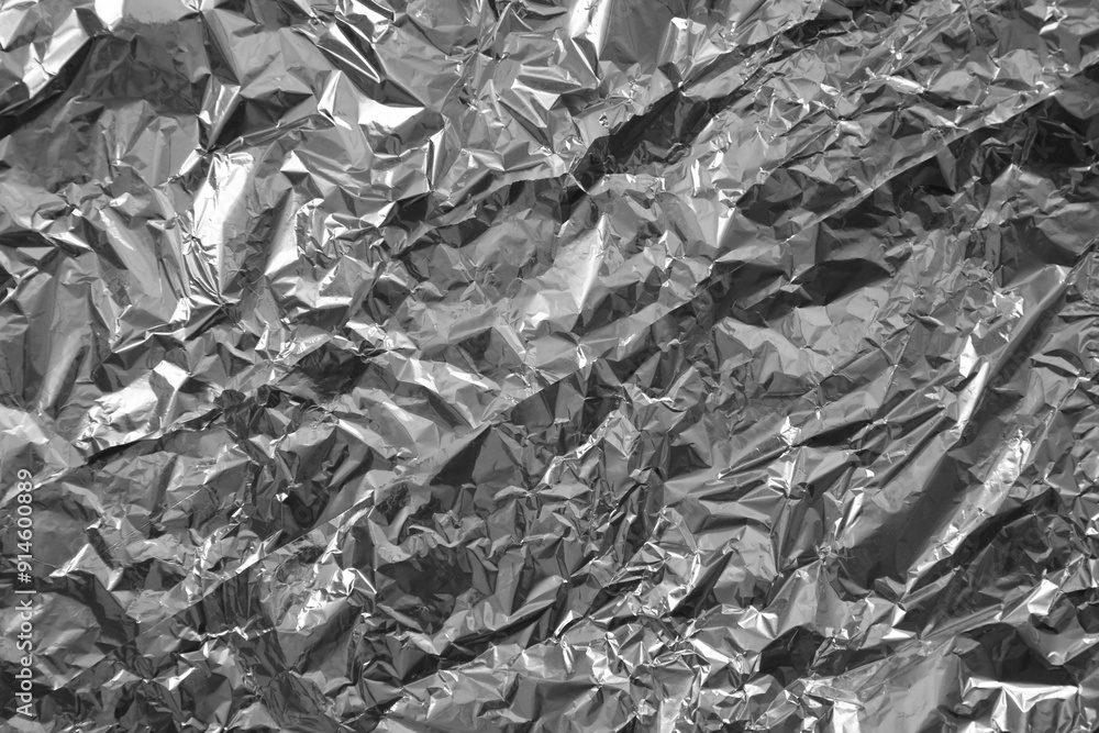Processed collage of shiny metal silver gray foil crumpled packaging material texture Processed collage of shiny metal silver gray foil crumpled packaging material texture
