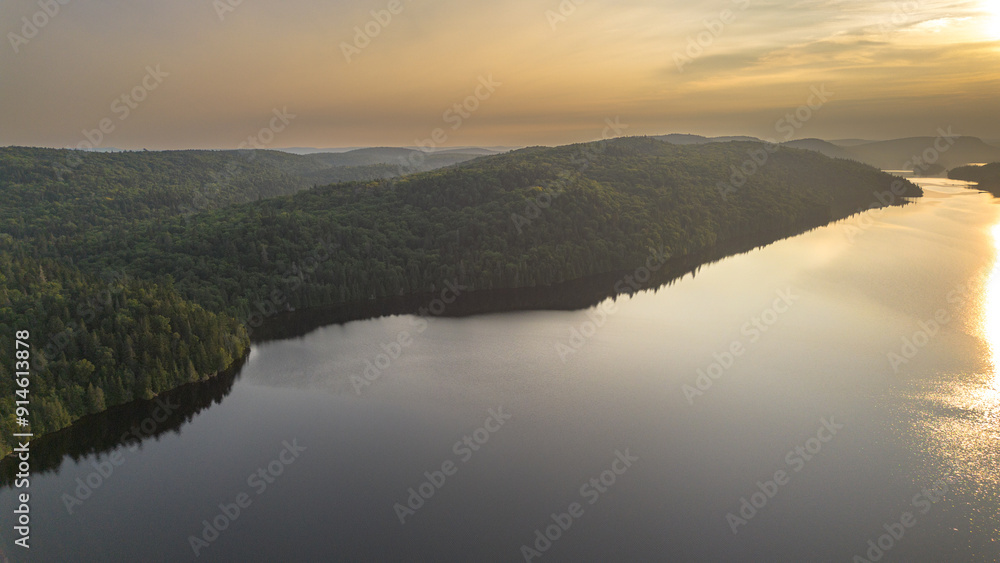 Fototapeta premium Sunset over a magnificent fishing lake in the Canadian forest