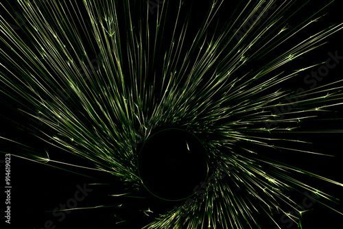 green sparks from the grinder glowing in the dark