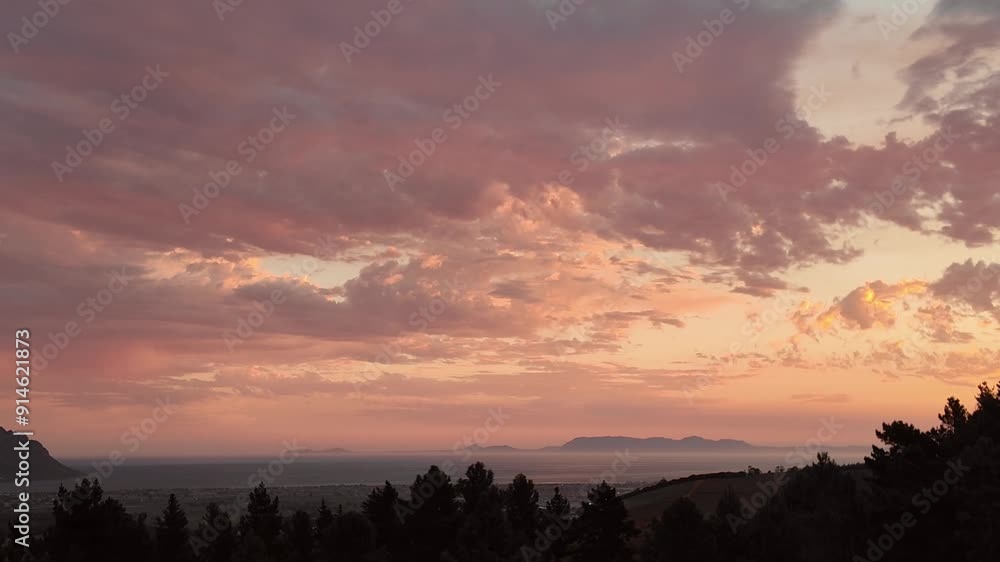 Somerset West Western Cape South Africa. 30.05.2024. Video. Late evening with pink coloured sky towards Cape Peninsula and Cape Point from Somerset West. Somerset West Western Cape South Africa. 30.05.2024. Video. Late evening with pink coloured sky towards Cape Peninsula and Cape Point from Somerset West.