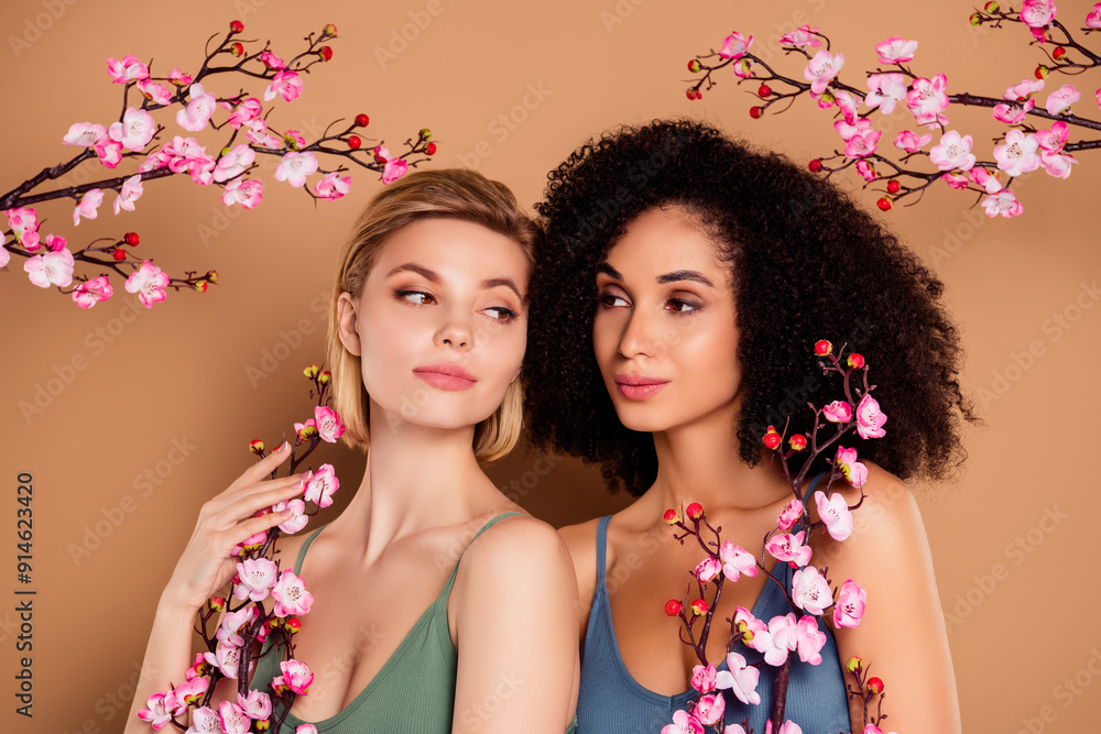Fototapeta premium Photo of shiny dreamy ladies dressed underwear top holding japanese cherry branches isolated beige color background