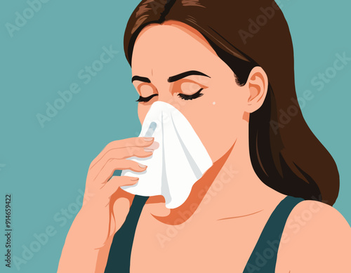 Woman blowing her nose 