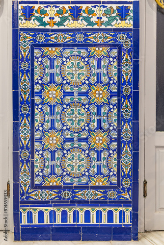 Colorful decorative tiles on a building in Granada.