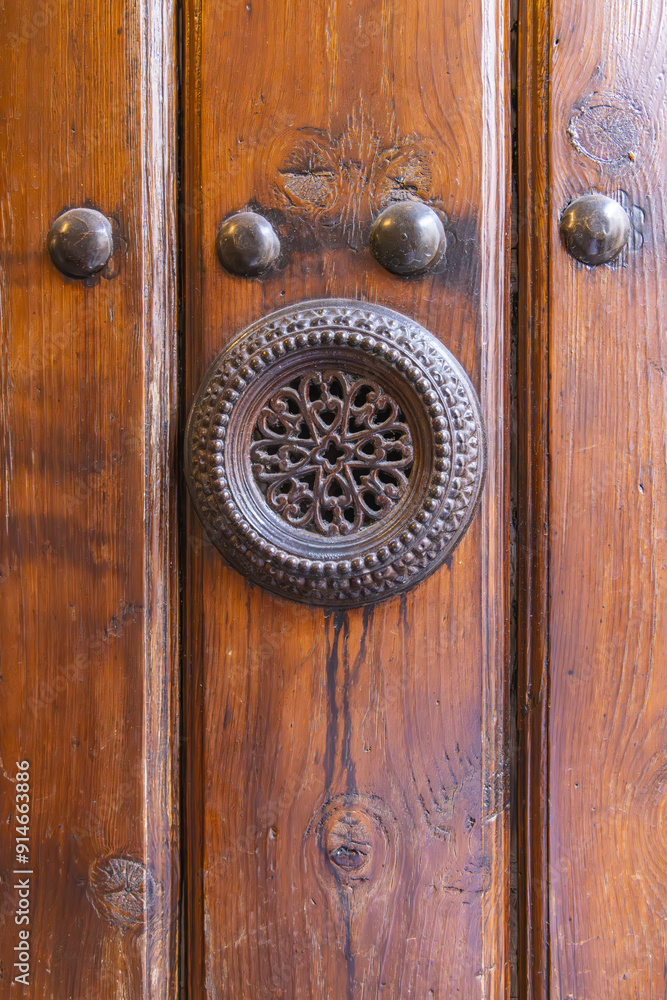 Fototapeta premium Metal peep hole on an old Spanish door.