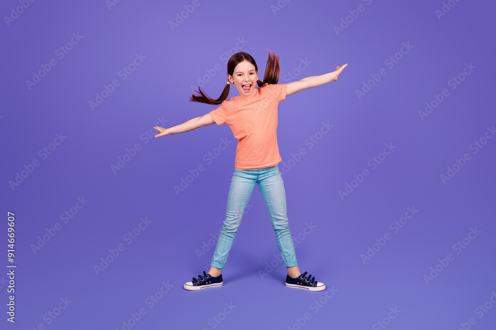 Full size photo of little girl spread hands fly surfing keep balance dance wear trendy red outfit isolated on purple color background Full size photo of little girl spread hands fly surfing keep balance dance wear trendy red outfit isolated on purple color background