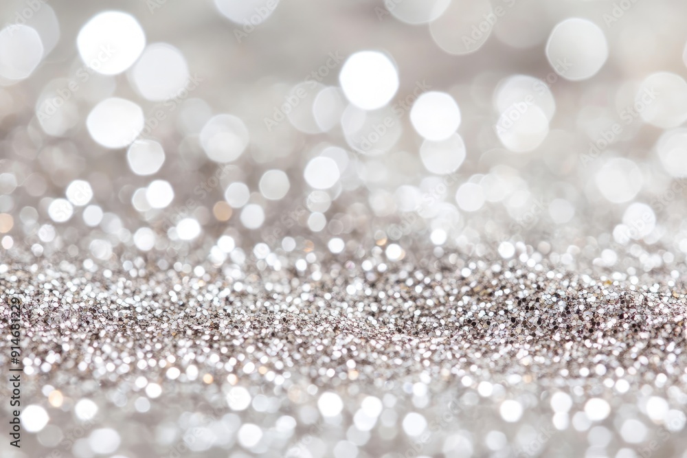 Abstract silver glitter background. Perfect for use in holiday and celebration designs.