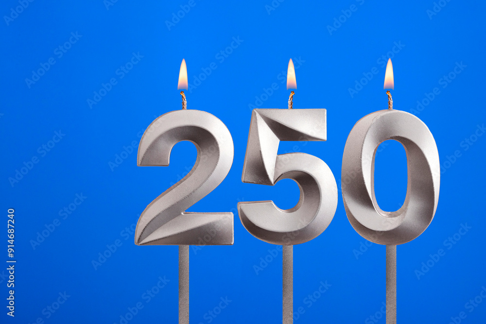 Birthday candle number 250 - Celebration card on blue background Birthday candle number 250 - Celebration card on blue background
