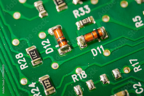 Small glass diodes on a printed circuit board.