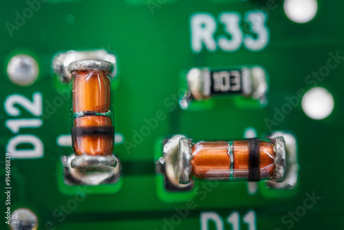 Small glass diodes on a printed circuit board. photo