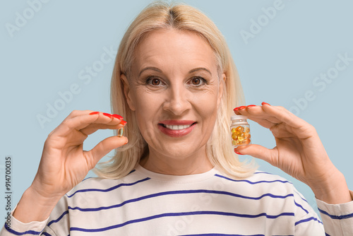 Mature woman with fish oil ...