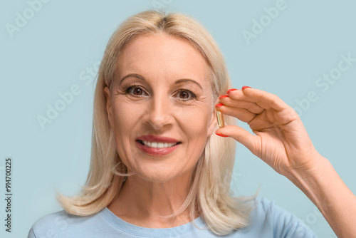 Mature woman with fish oil ...