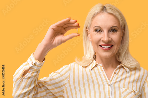 Mature woman with fish oil ...