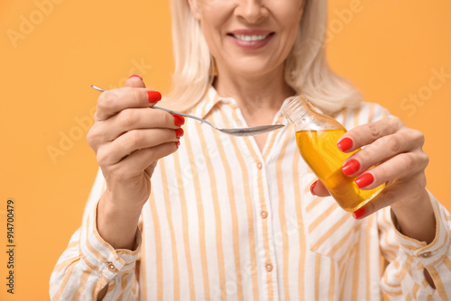 Mature woman with fish oil ...