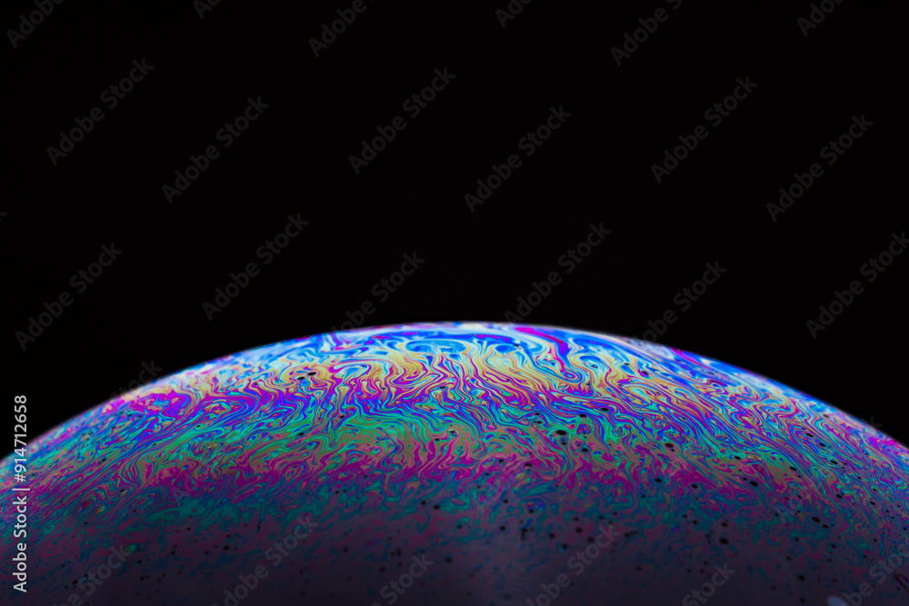 Soap bubble. Abstract background. Space model. Streaks of fluid. Surface with psychedelic colors. Virtual reality planet. Free space for an inscription. Conceptual image of the universe. Soap bubble. Abstract background. Space model. Streaks of fluid. Surface with psychedelic colors. Virtual reality planet. Free space for an inscription. Conceptual image of the universe.