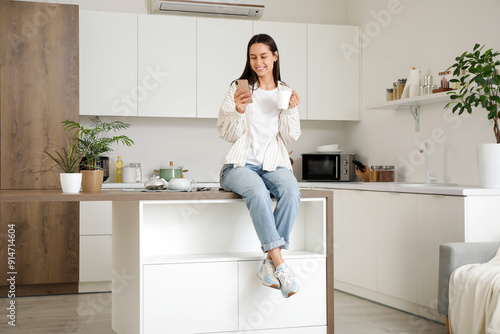 Young pretty woman with cup...