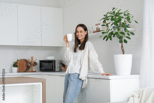 Young woman with cup near c...