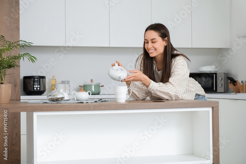 Young pretty woman pouring ...