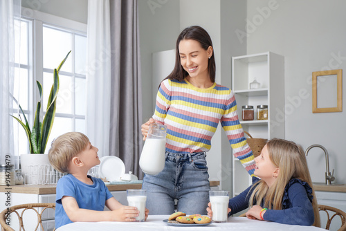 Happy family drinking milk ...
