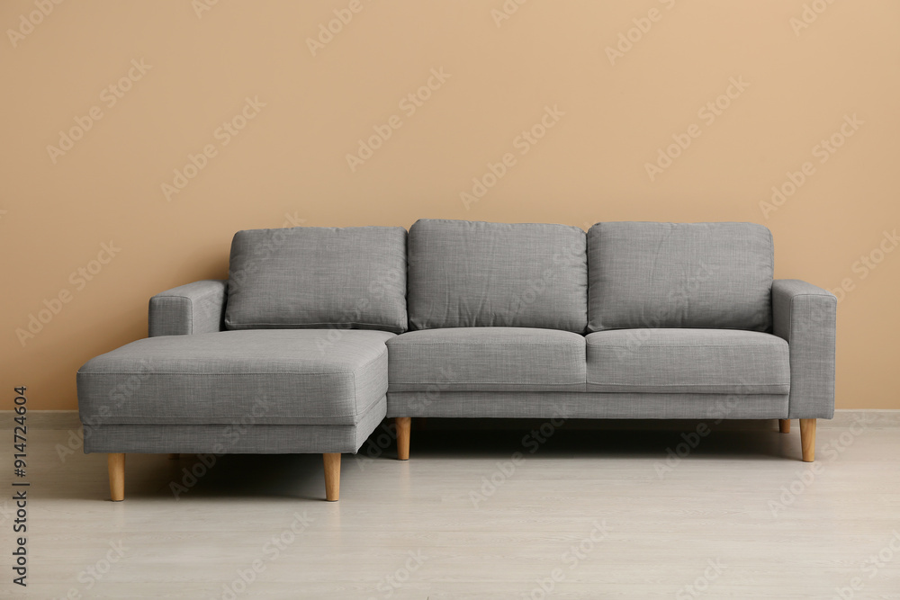 © Pixel-Shot - Cozy sofa near beige wall in living room © Pixel-Shot - Cozy sofa near beige wall in living room