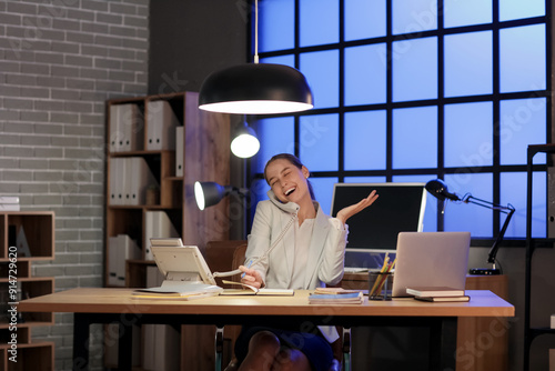 Young woman sitting at work...