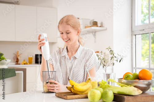 Happy young woman with blen...