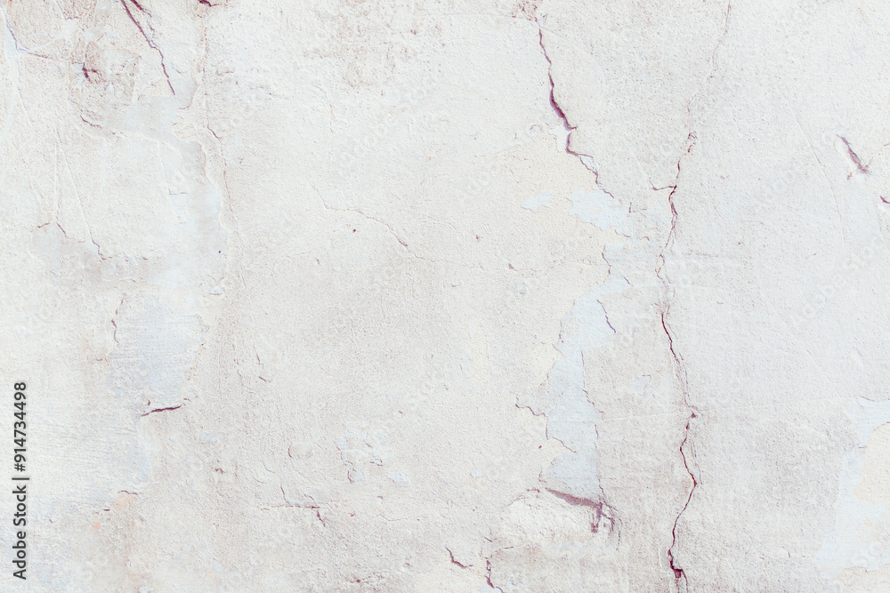 White plaster wall with natural defects. Fragment of the grunge surface. Natural cracked cement on a light wall. Textured background for integration into the design. White plaster wall with natural defects. Fragment of the grunge surface. Natural cracked cement on a light wall. Textured background for integration into the design.