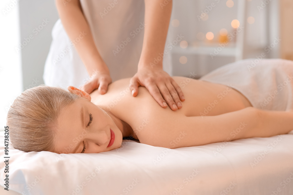 Young woman having spine massage in spa salon Young woman having spine massage in spa salon