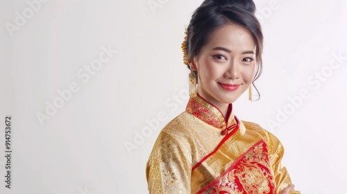 Asian woman wearing traditional gold and red dress with ornate jewelry