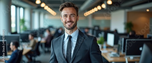 Successful businessman smiling in the office.