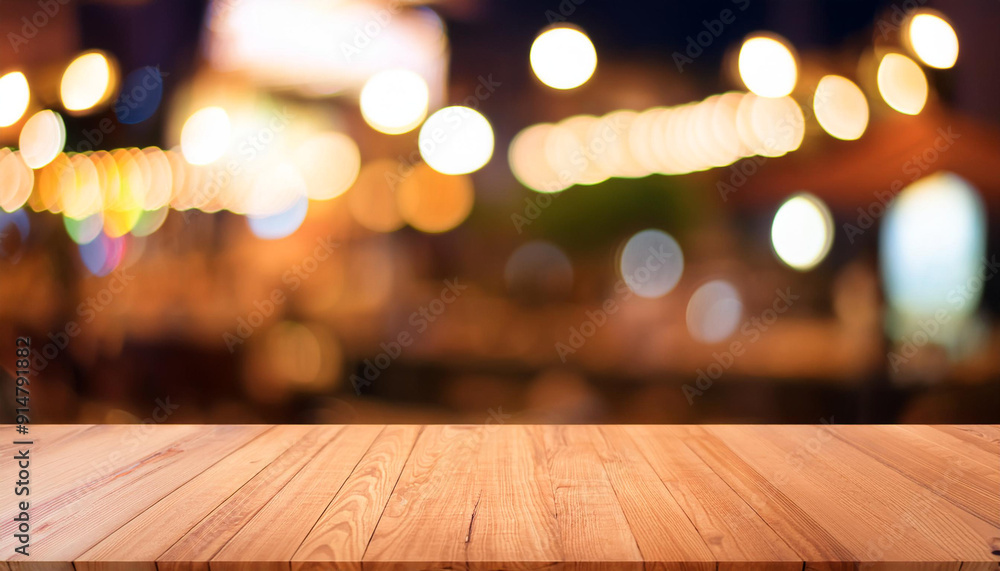 Wood table top with reflect on blur of lighting in night cafe, restaurant background/ selective focus. Wood table top with reflect on blur of lighting in night cafe, restaurant background/ selective focus.