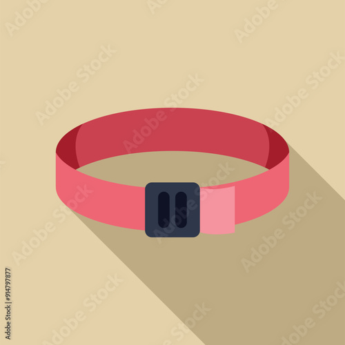 Pink wristband lying flat on a surface with a long shadow