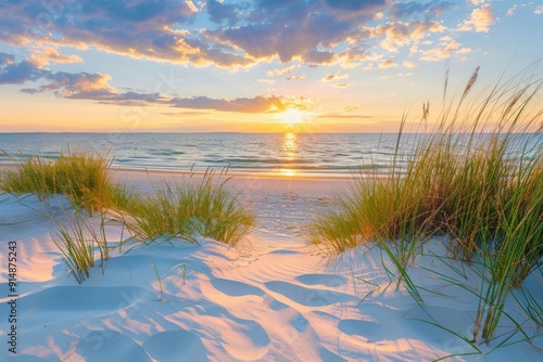 Sunset Over a Sandy Beach with Lush Grass