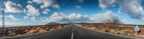 Empty Road Leading Through a Volcanic Landscape