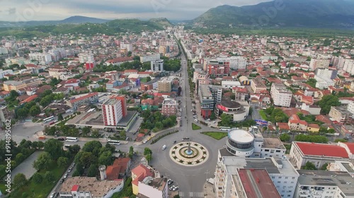 View of the central square Sheshi Demokracia with fountain and modern buildings, Albania, Southeast Europe. Also visible is the Migjeni theater. photo