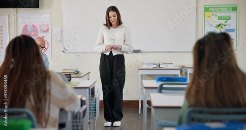 Classroom, student and presentation in high school, biology and lesson for learning or development. Female person, education and reading notes for assignment, science project and oral exam for grades