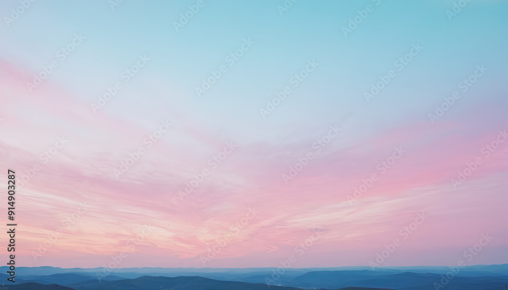 Fototapeta premium Soft pastel colors blend in the sky as clouds disperse over rolling hills during a tranquil evening, creating a peaceful atmosphere at dusk