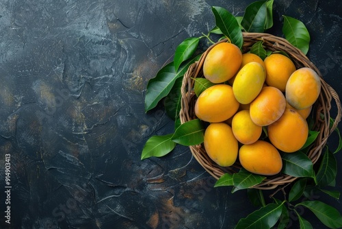 Yellow Fruit in a Wicker Basket on a Dark Background