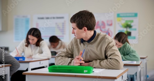 Thinking, student and writing for test in class for university exams, project and academic assignment. Man, remember and brainstorm for learning, homework and education with development in classroom
