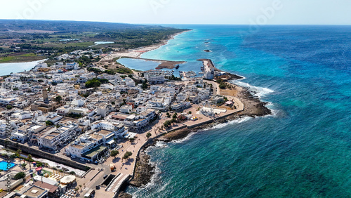 Torre San Giovanni is renowned for its long white beaches of incredible beauty and quality combined with a particularly light blue and transparent sea with shallow waters for very long stretches photo