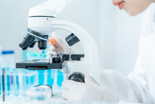 Scientist analyze biochemical samples in advanced scientific laboratory. Medical professional use microscope look microbiological developmental of viral. Biotechnology research in science lab...