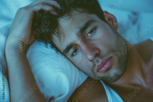 Embarrassed man in bed