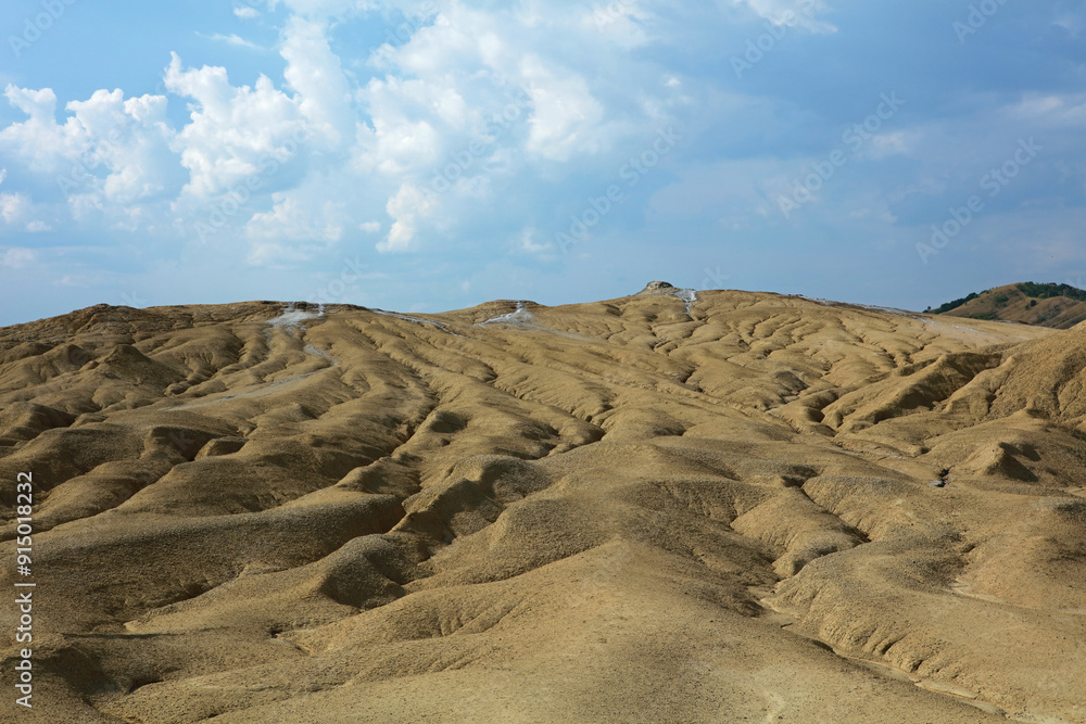 Landscape formed by the dried off volcanic mud in Berca Mud Volcanoes area in Romania Landscape formed by the dried off volcanic mud in Berca Mud Volcanoes area in Romania