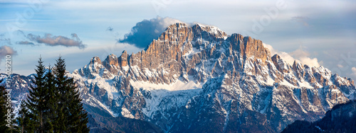 Obraz na płótnie Dolomites, Italy. Civetta mountain at sunrise viewed from Pieve di Livinalongo near Arabba. Wide panorama w salonie