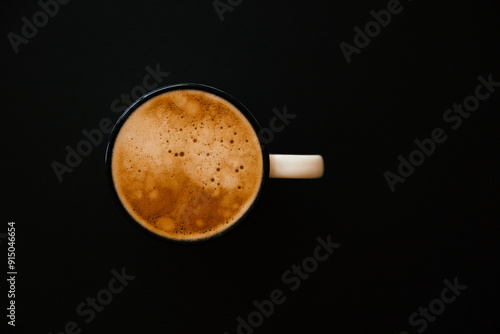 cup of espresso coffee on black background