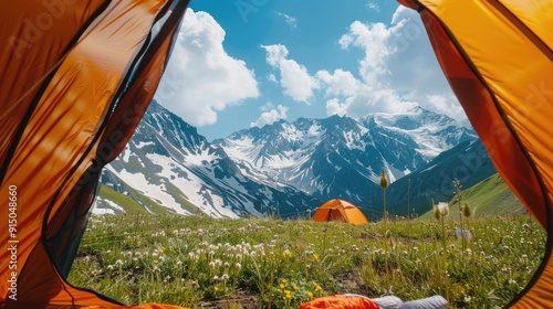 Camping tent on the background of snowy mountains photo