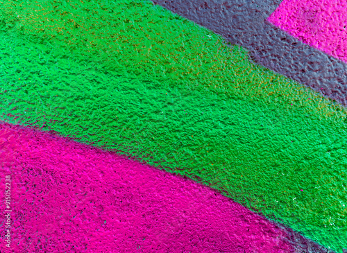 Colorful beautiful background of urban spray drawing graffiti on city wall. Bright vivid pattern of  modern art for wallpaper and design.