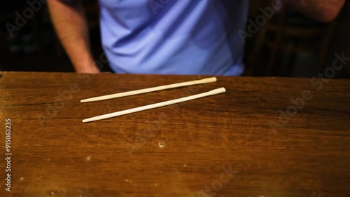 Beer Glass Trick with Chopsticks photo