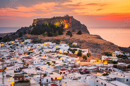 Obraz na płótnie Lindos, Rhodes. Small whitewashed town and the ancient Acropolis, Aegean Sea landscape in Greek Islands, Greece. w salonie
